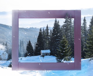 Image of Wooden frame and house near beautiful mountain forest in winter