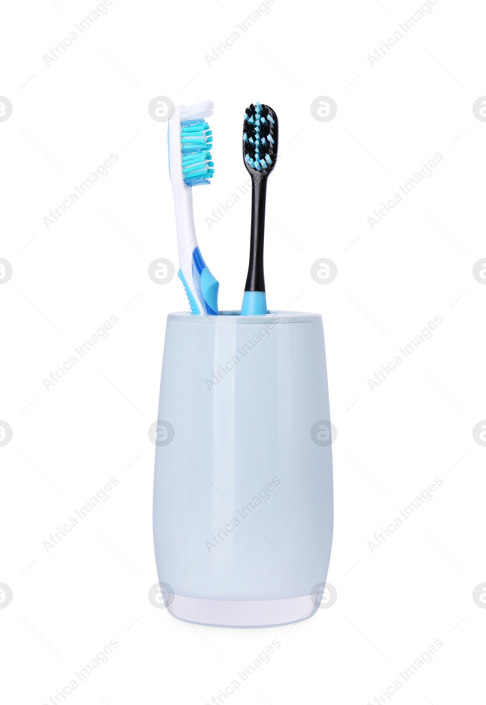 Photo of Two plastic toothbrushes in holder isolated on white