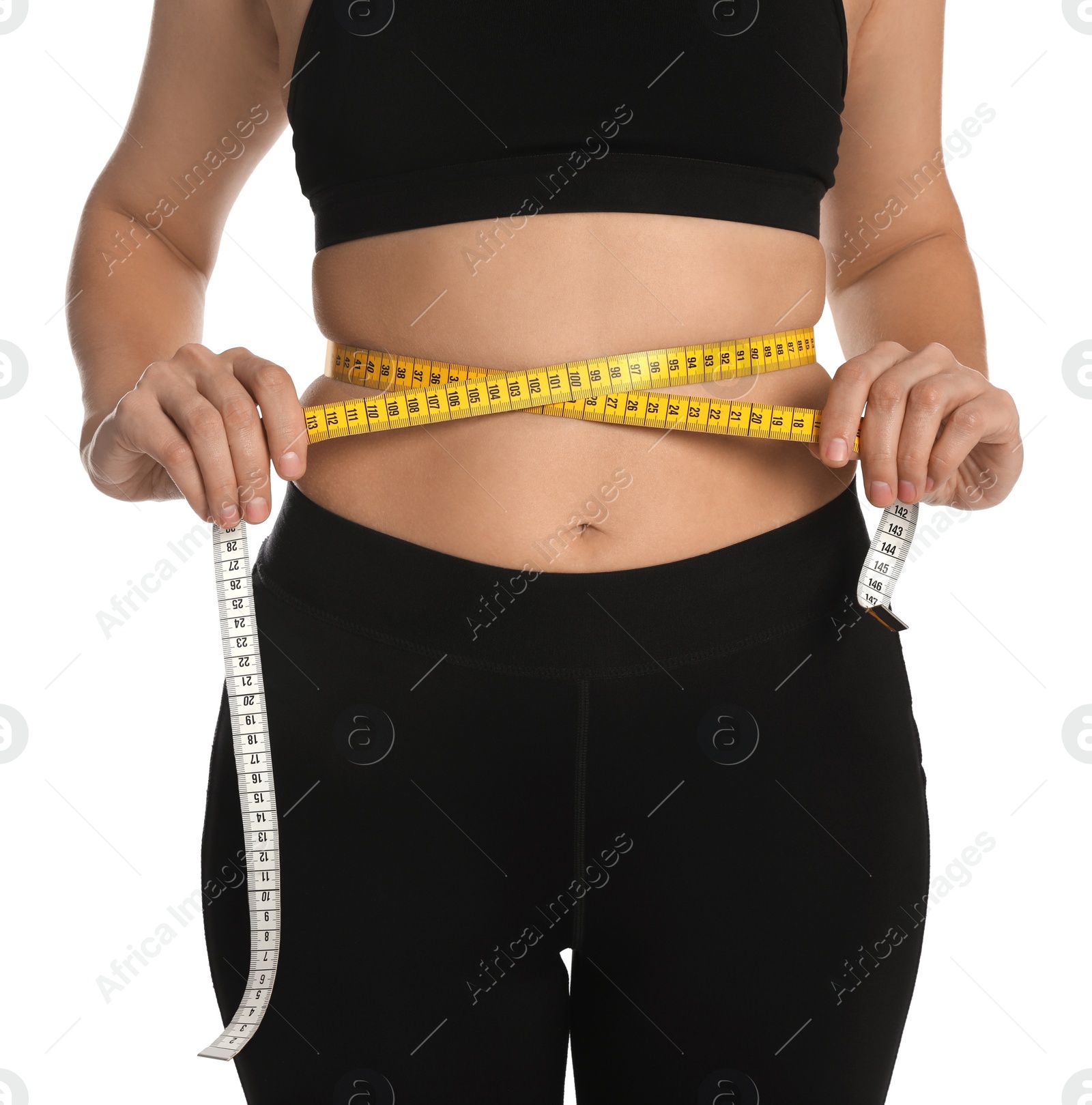 Photo of Woman measuring waist with tape on white background, closeup