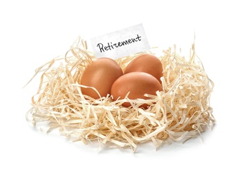 Eggs and card with word RETIREMENT in nest on white background. Pension concept