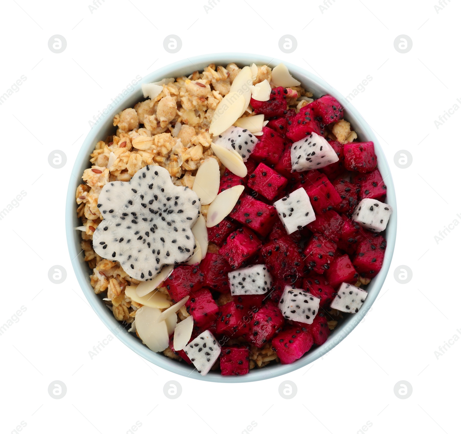 Photo of Bowl of granola with pitahaya and almond petals on white background, top view