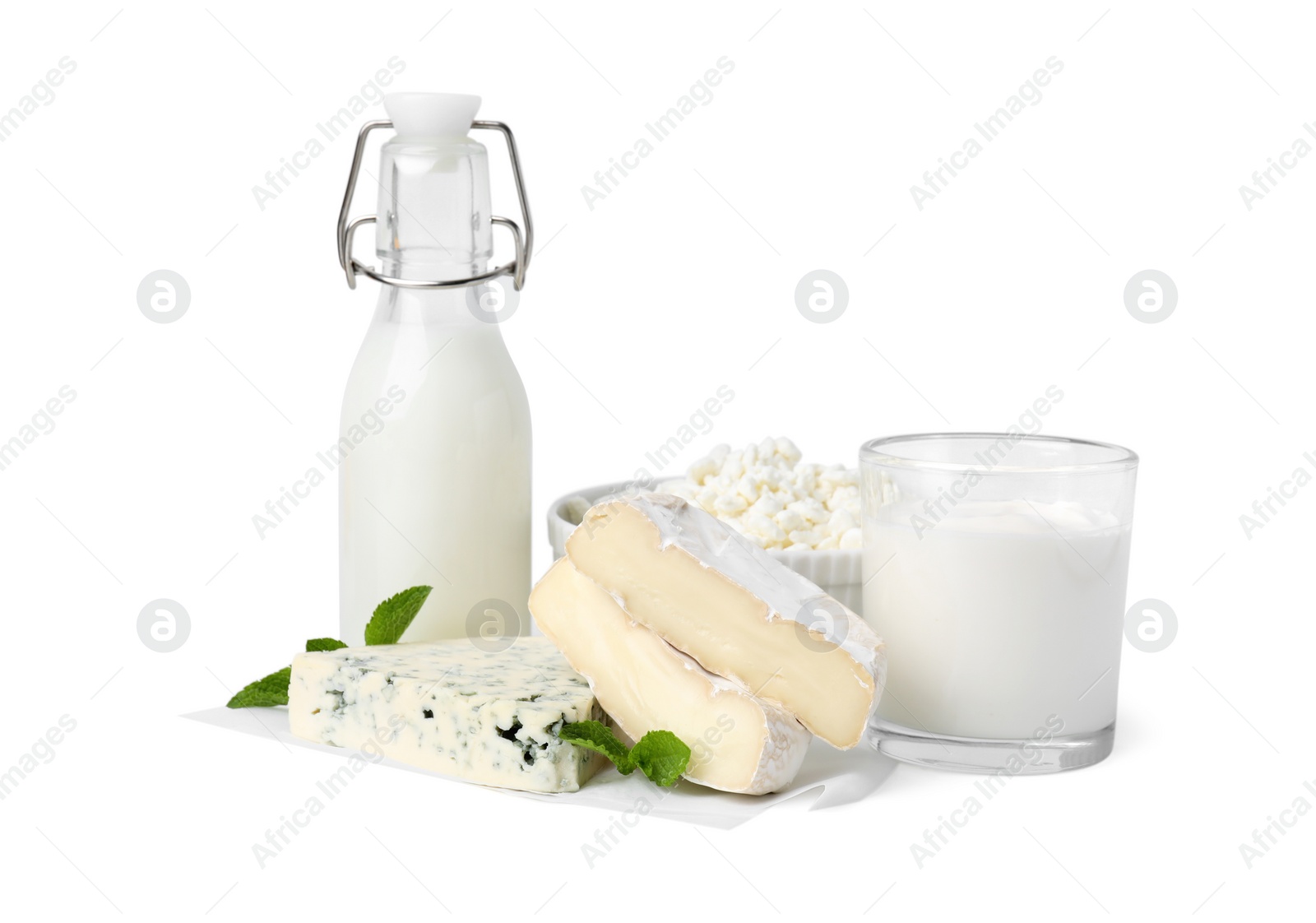 Photo of Different fresh dairy products and mint isolated on white