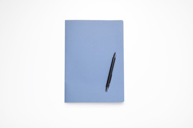 Photo of Monthly planner and pen on white background, top view