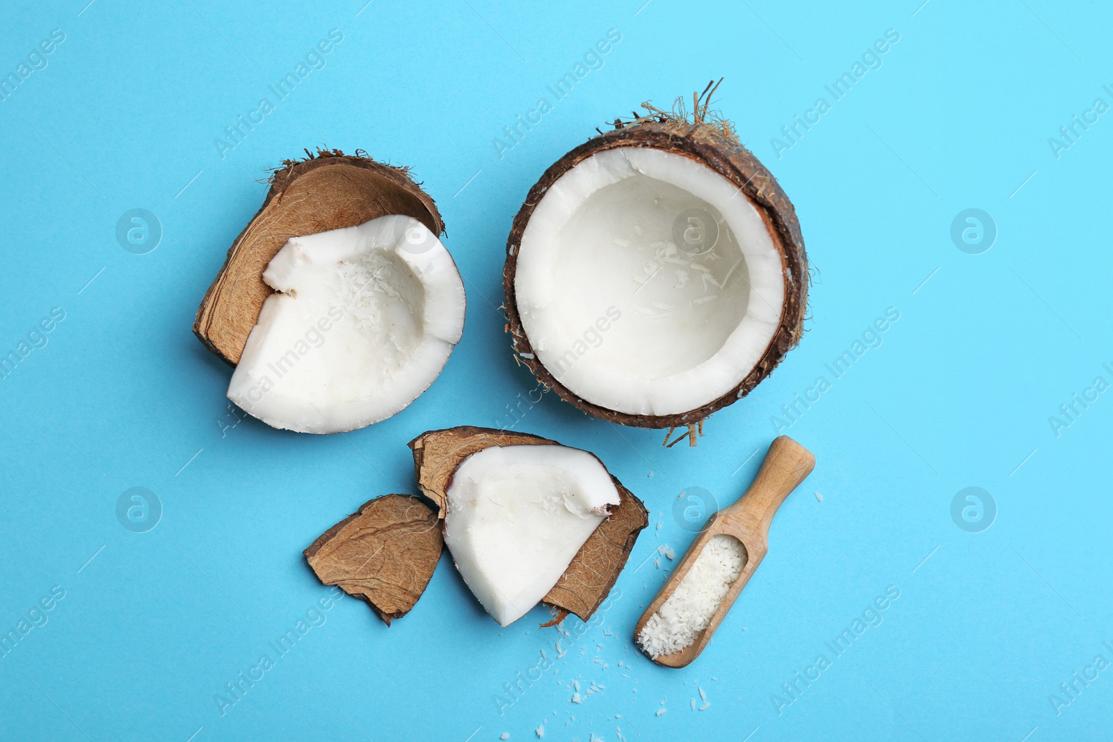 Photo of Composition with fresh cracked coconut on color background, top view