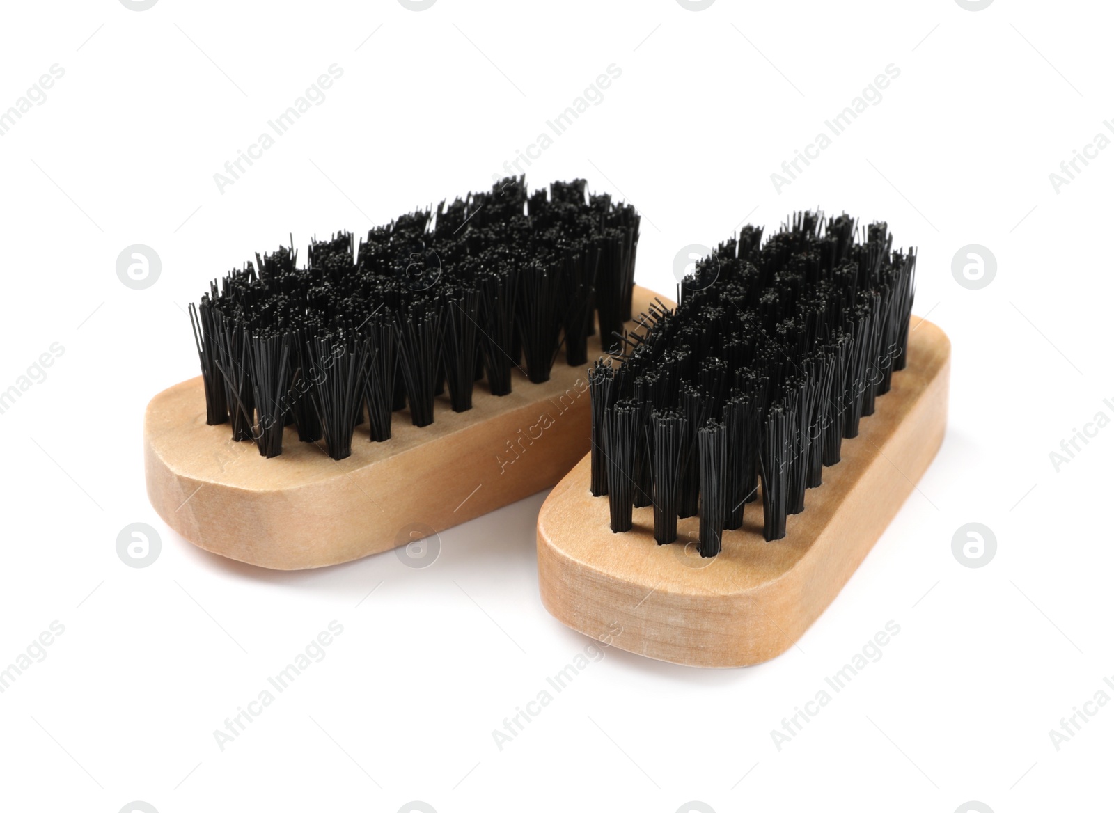 Photo of Shoe brushes on white background. Footwear care item