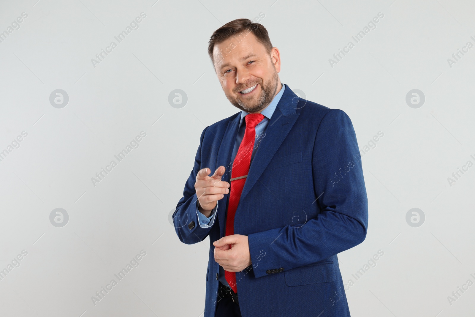 Photo of Portrait of happy mature man on light grey background