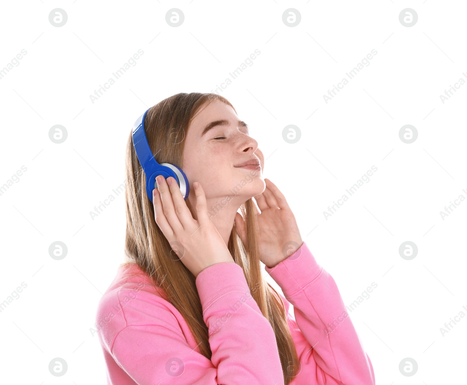 Photo of Teenage girl enjoying music in headphones on white background