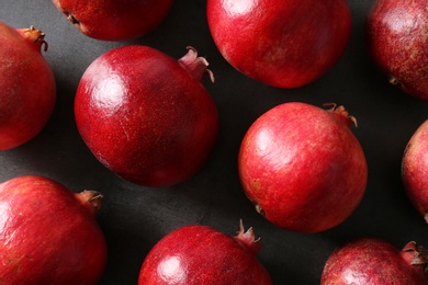 Photo of Flat lay composition with pomegranates on grey background