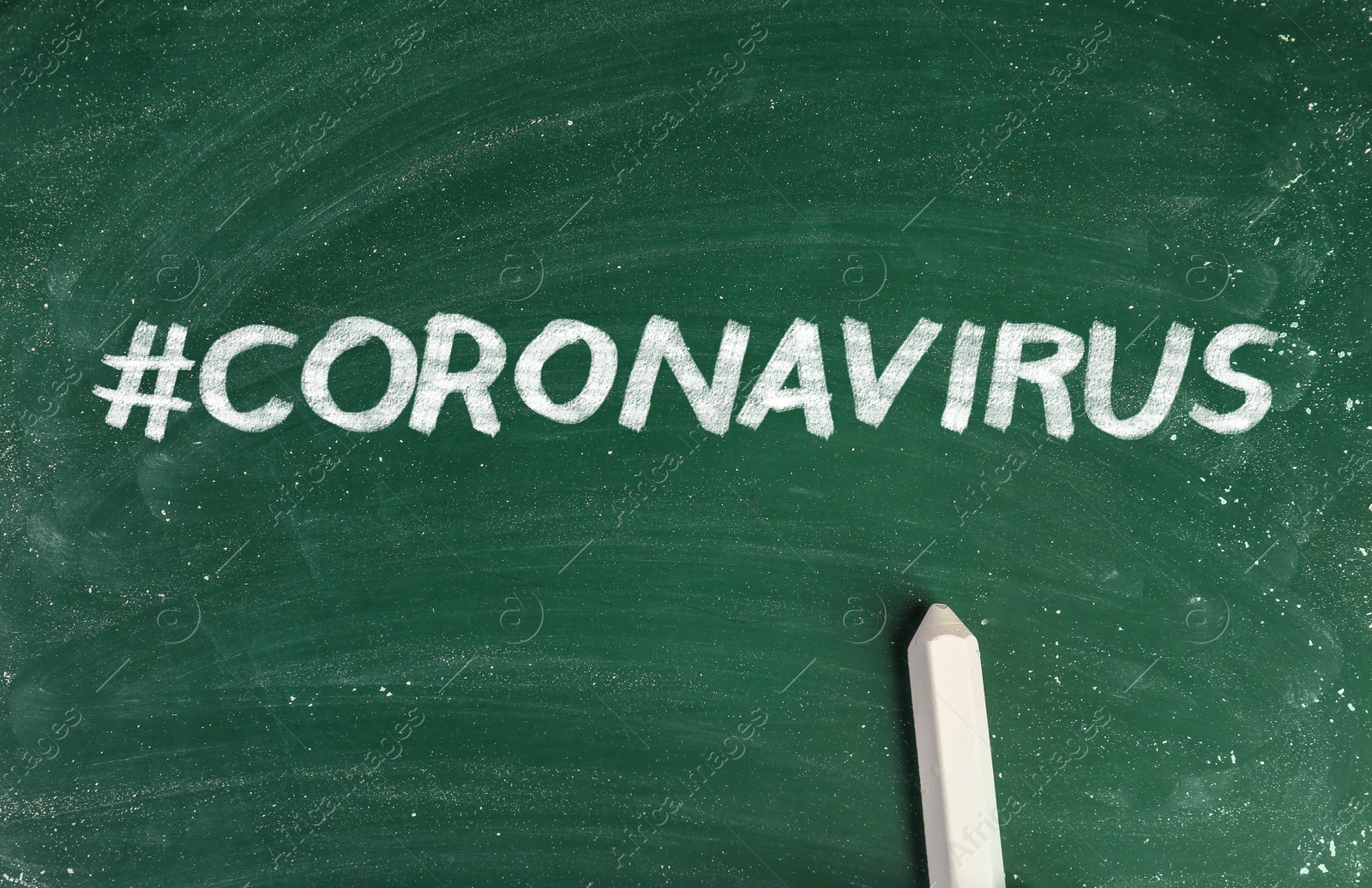 Image of Hashtag Coronavirus and piece of white chalk on greenboard, top view