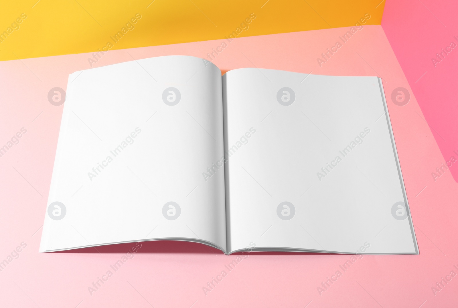 Photo of Empty book pages on color background. Mockup for design