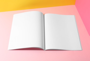 Photo of Empty book pages on color background. Mockup for design