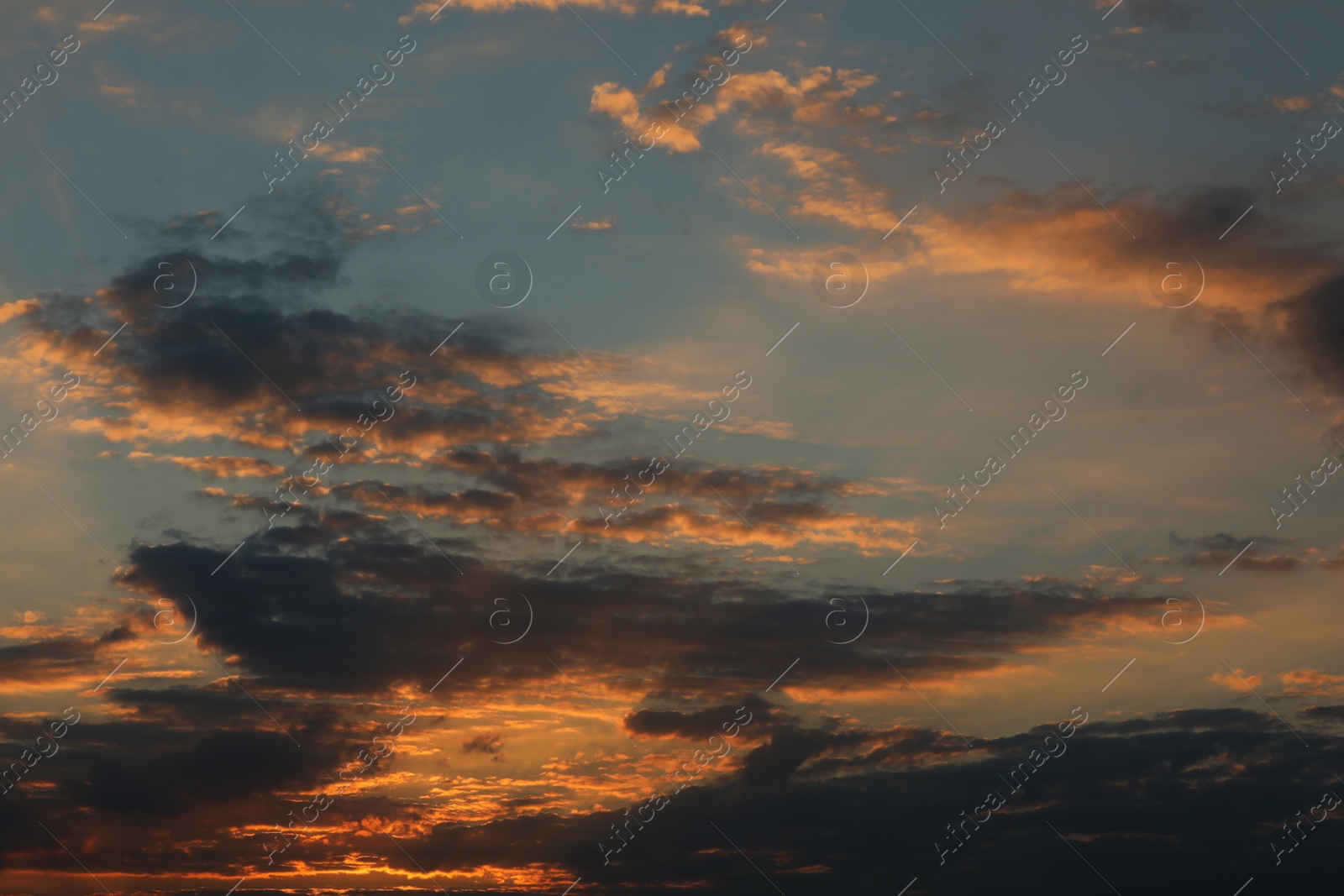 Photo of Picturesque view of sunset sky with beautiful clouds