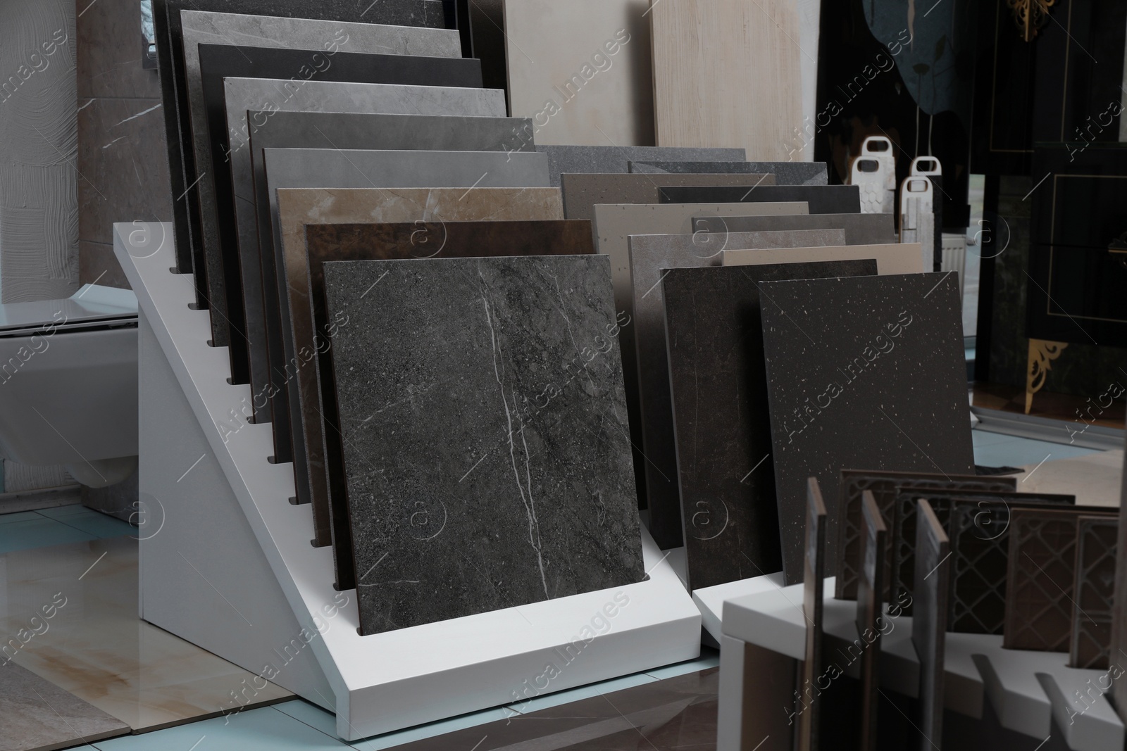 Photo of Many different samples of tiles on display in store