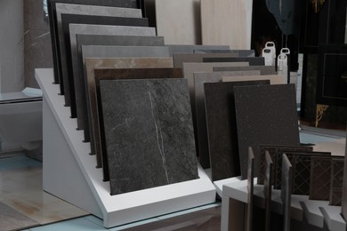 Photo of Many different samples of tiles on display in store