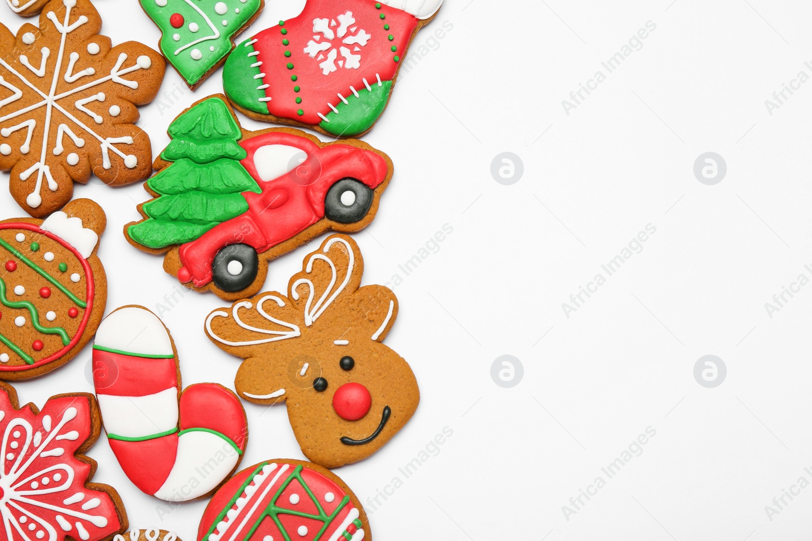 Photo of Different tasty Christmas cookies on white background, flat lay. Space for text