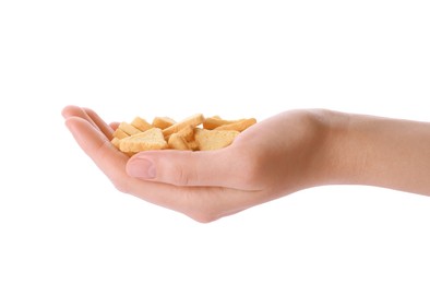 Photo of Woman holding crispy rusks on white background, closeup