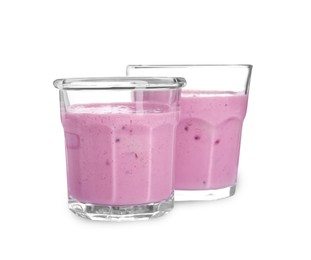 Photo of Delicious blackberry smoothie in glasses on white background