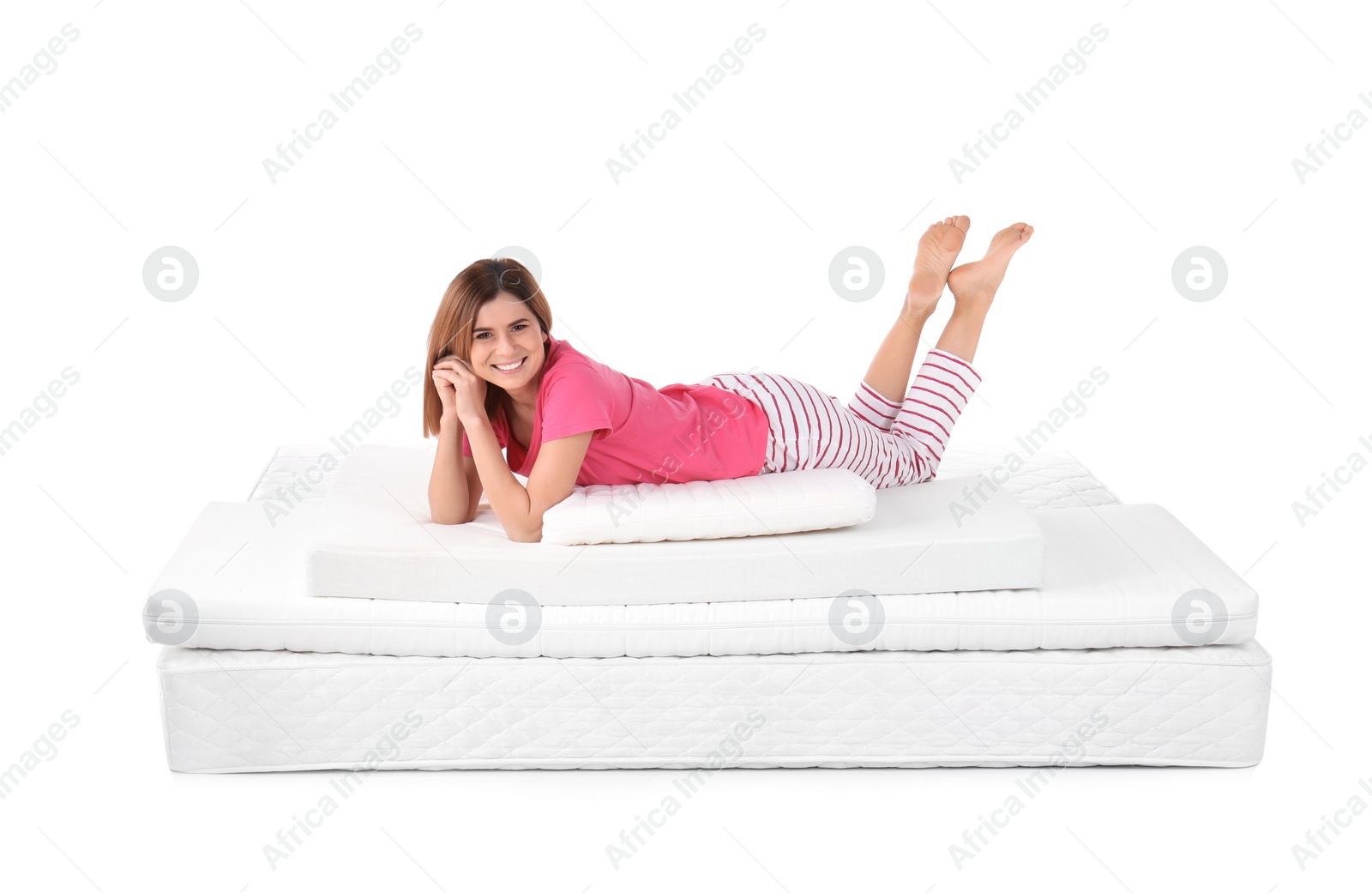 Photo of Woman lying on mattress pile against white background