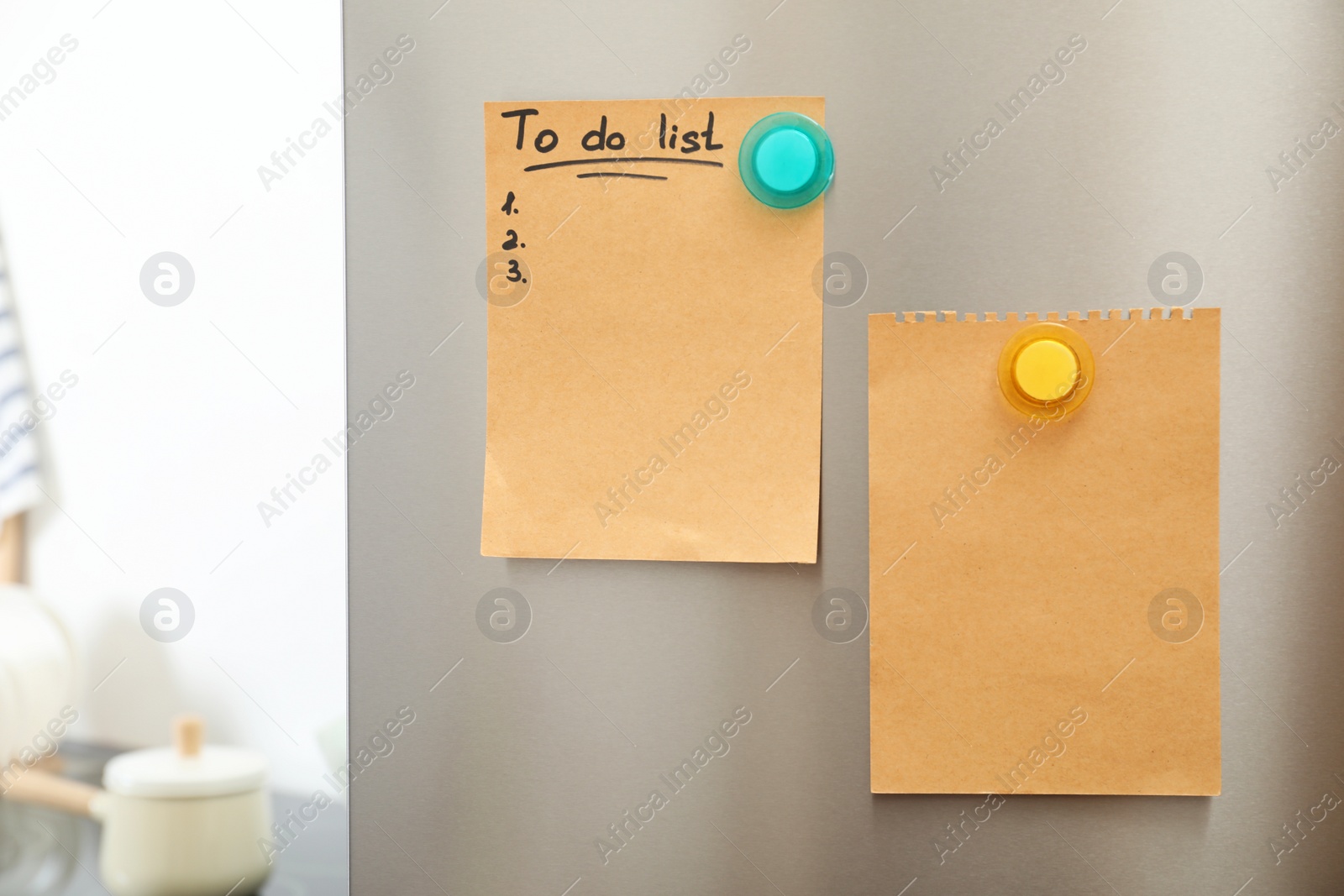 Photo of To do list and empty sheet of paper with magnets on refrigerator door in kitchen. Space for text