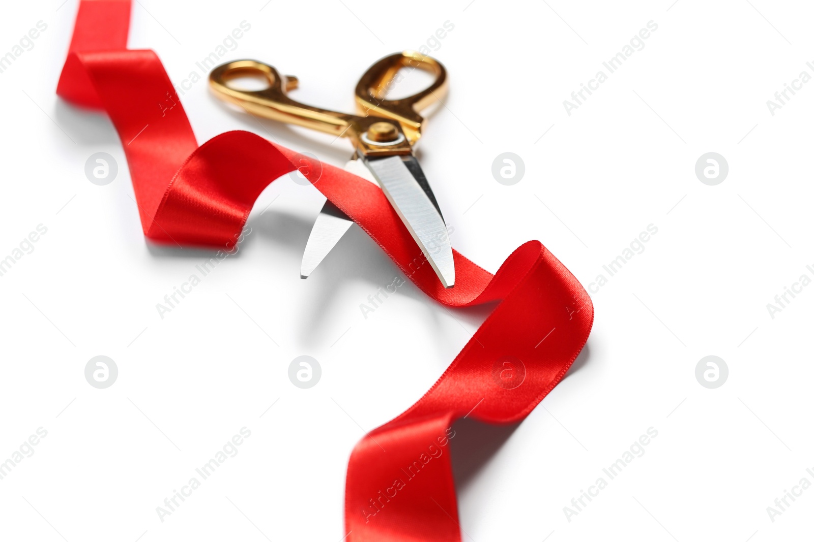 Photo of Ribbon and scissors on white background. Ceremonial red tape cutting