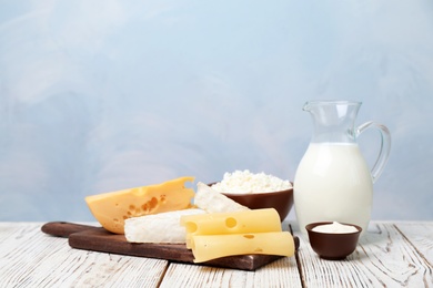 Different dairy products on wooden table