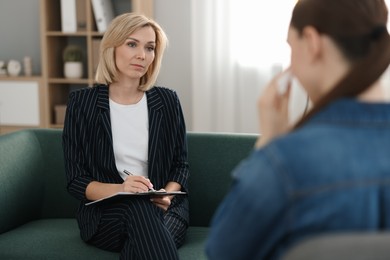 Photo of Professional psychotherapist working with patient in office