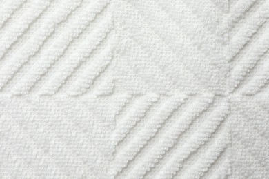 Photo of Texture of white fabric as background, top view