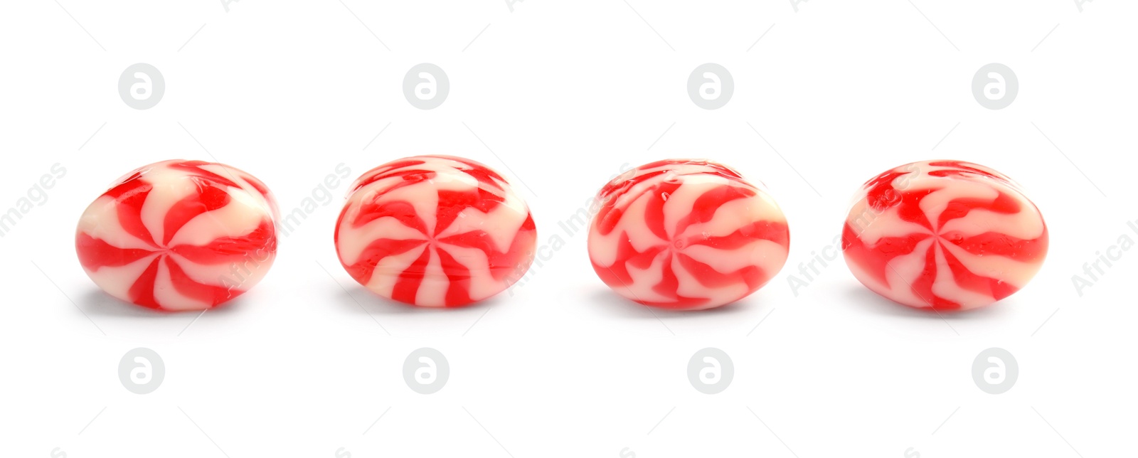 Photo of Delicious colorful candies on white background