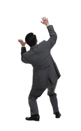 Scared businessman in suit posing on white background