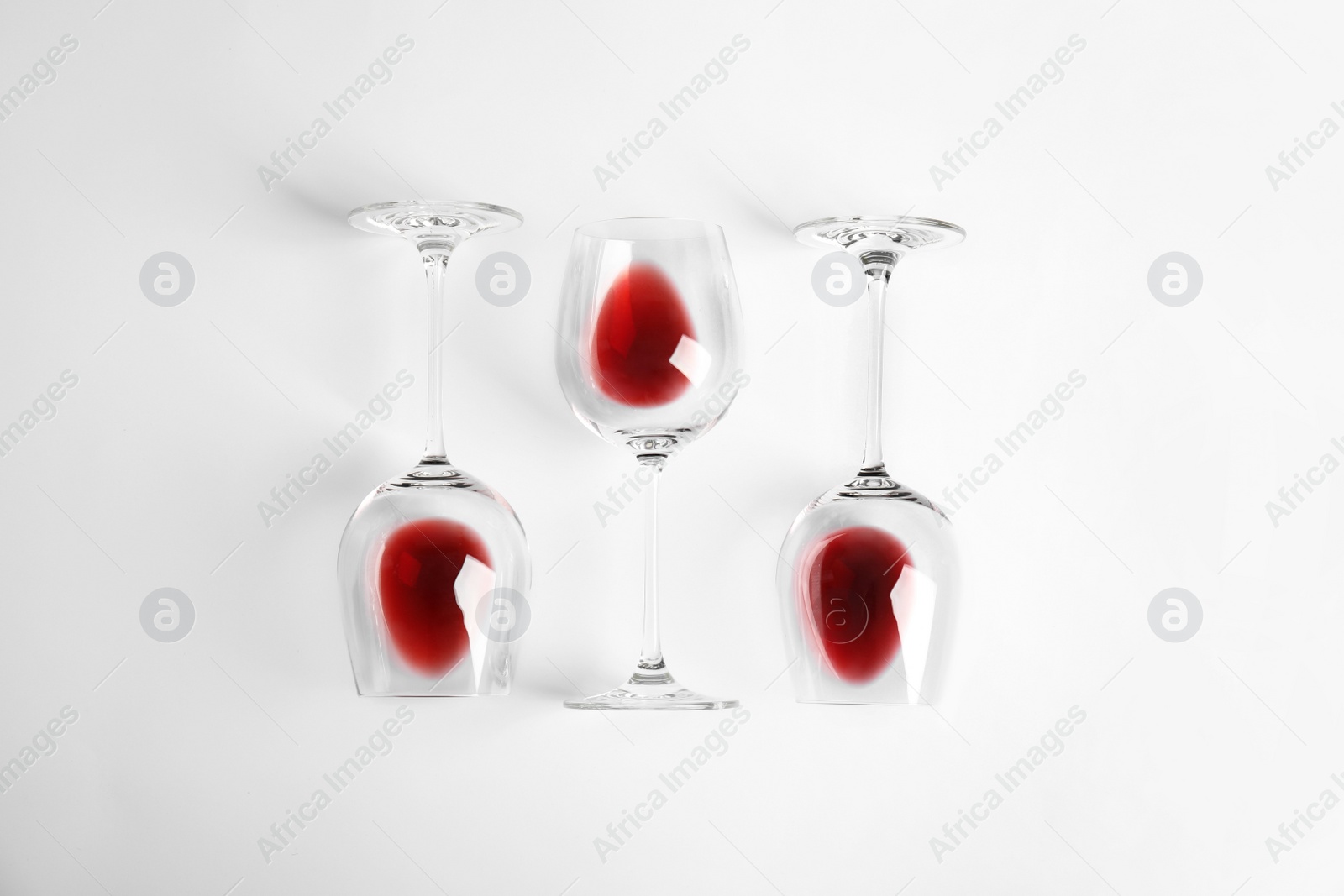 Photo of Composition with glasses of wine on white background, top view