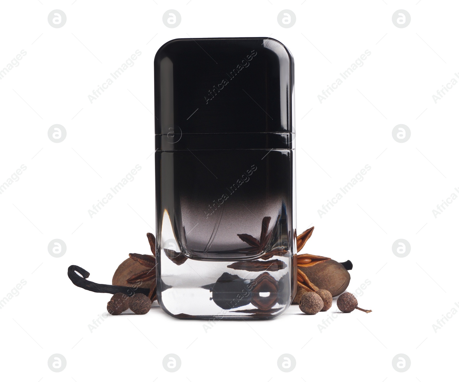 Photo of Bottle of perfume and different spices on white background