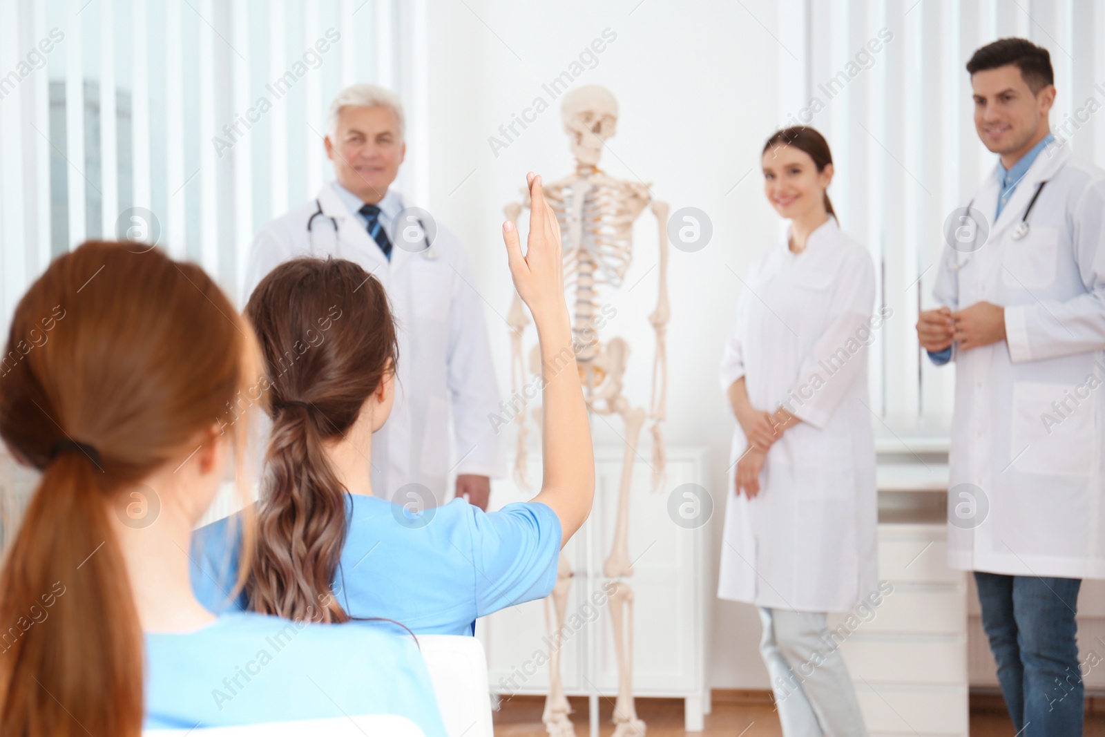 Photo of Medical students having lecture in orthopedics at clinic