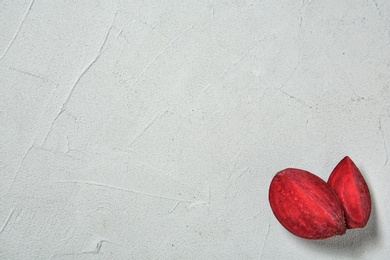 Ripe beet slices on light background with space for text, top view