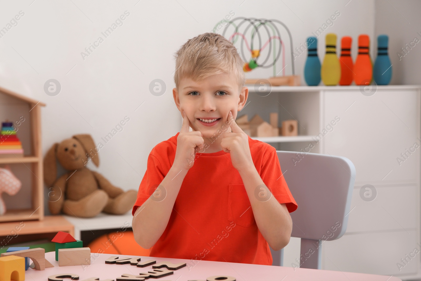 Photo of Cute little boy at speech therapist office