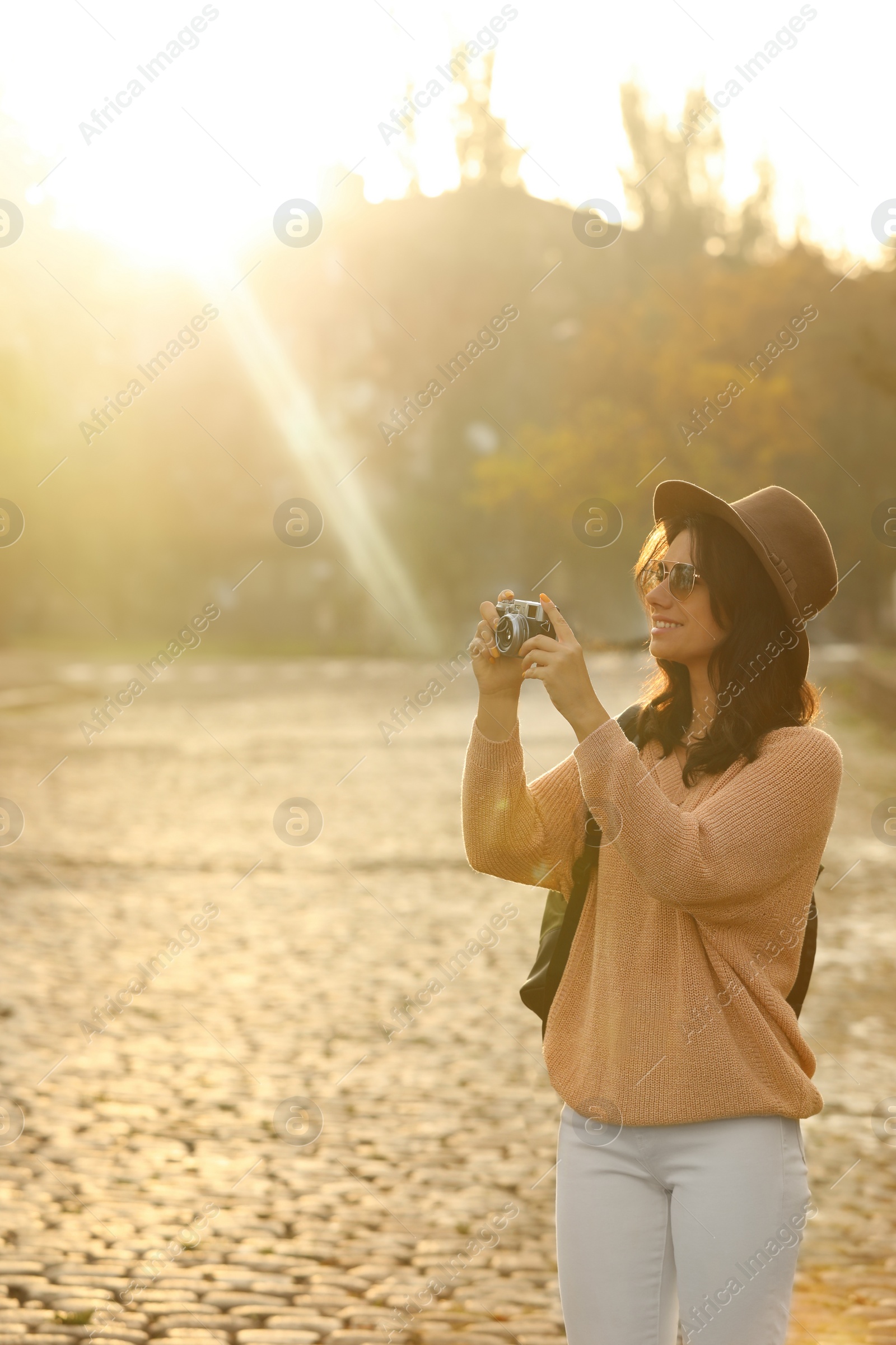 Photo of Traveler with photo camera on city street