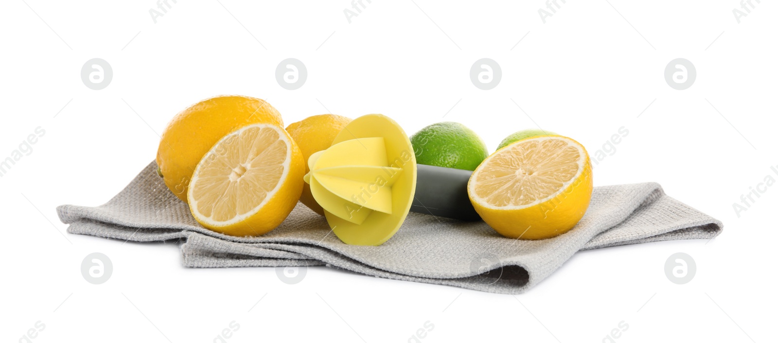 Photo of Plastic juicer, fresh lime and lemons on white background