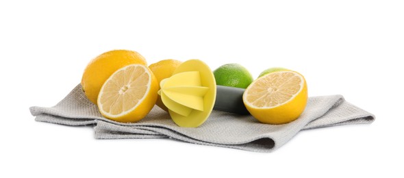 Photo of Plastic juicer, fresh lime and lemons on white background