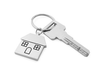 Photo of Key with metallic keychain in shape of house isolated on white