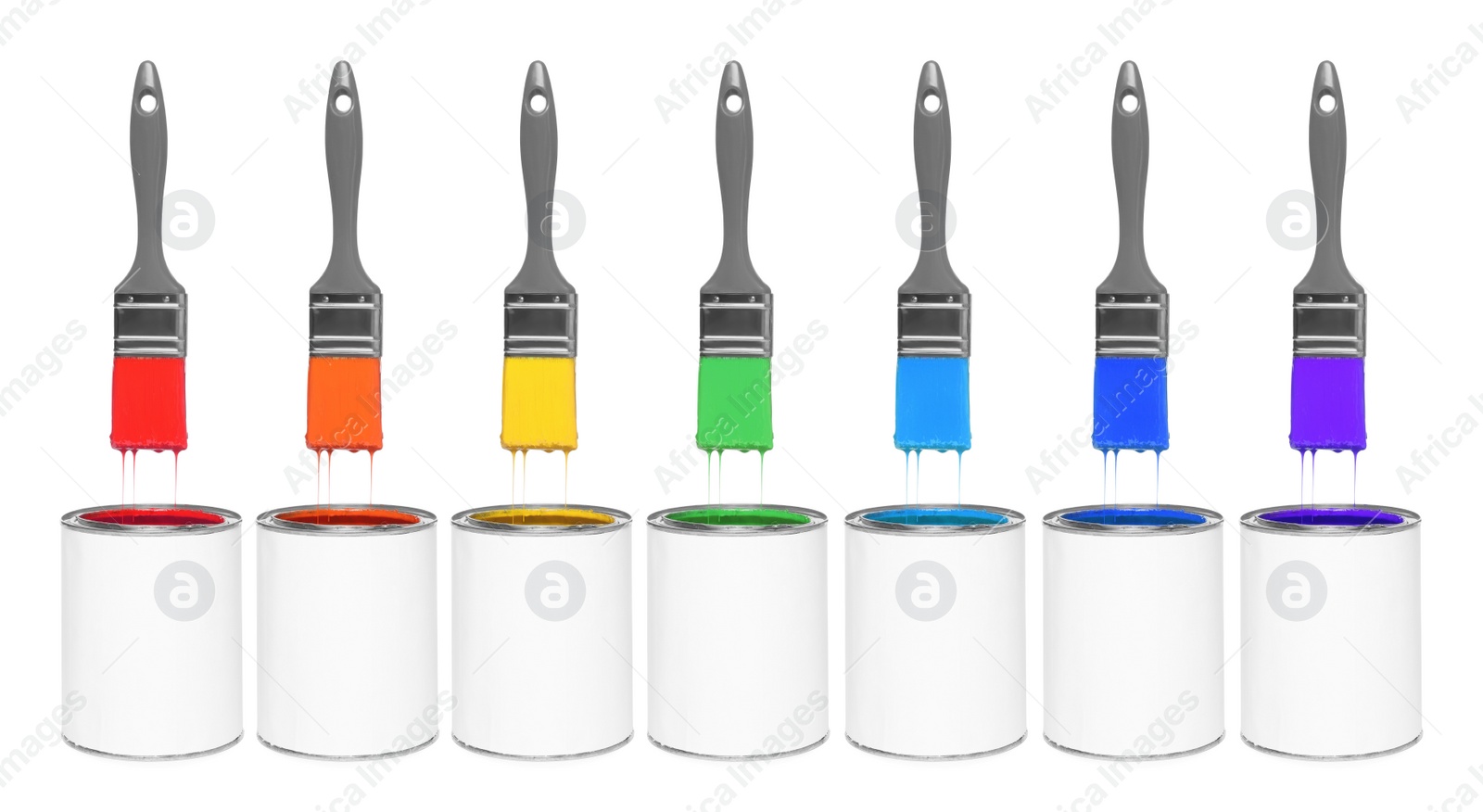 Image of Brushes with colorful paints in air over cans on white background