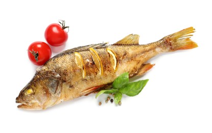 Photo of Tasty homemade roasted perch with basil and tomatoes on white background, top view. River fish