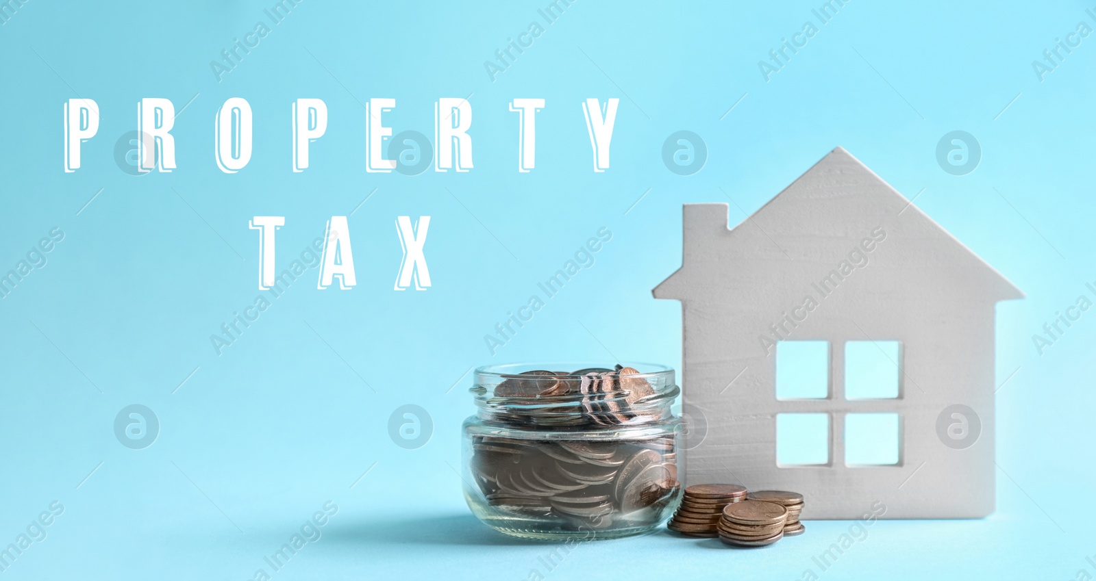 Image of Text Property Tax near jar full of coins and house model on light blue background. Banner design