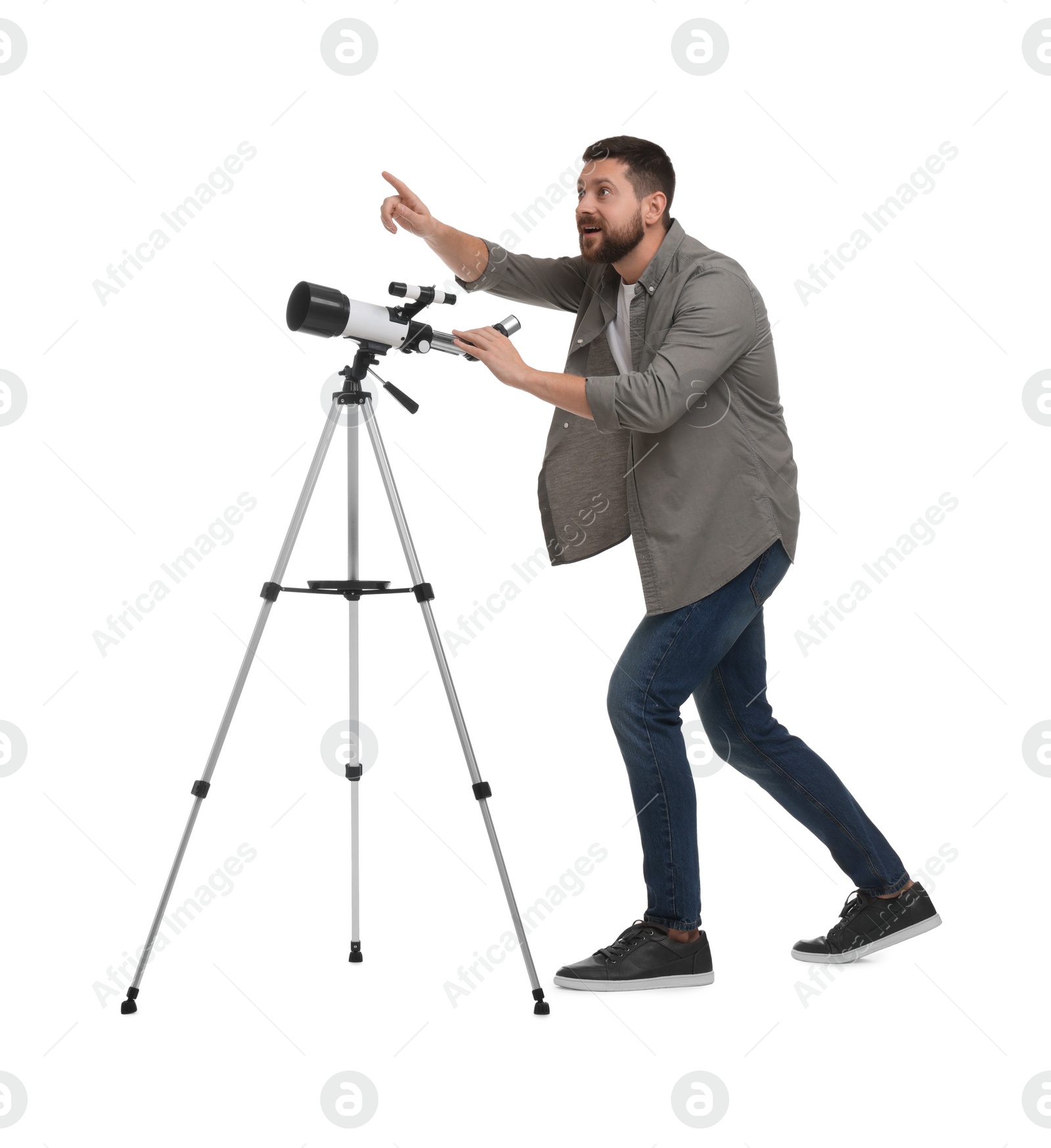 Photo of Excited astronomer with telescope pointing at something on white background