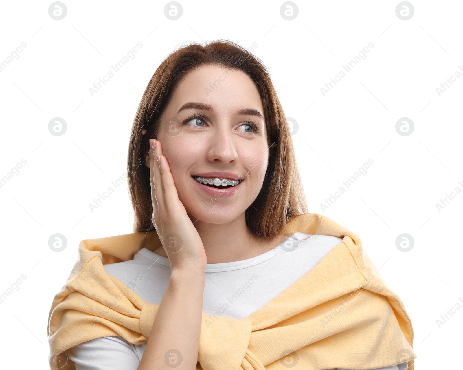 Photo of Portrait of smiling woman with dental braces on white background