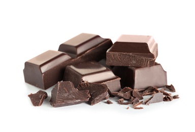 Pieces of tasty dark chocolate on white background