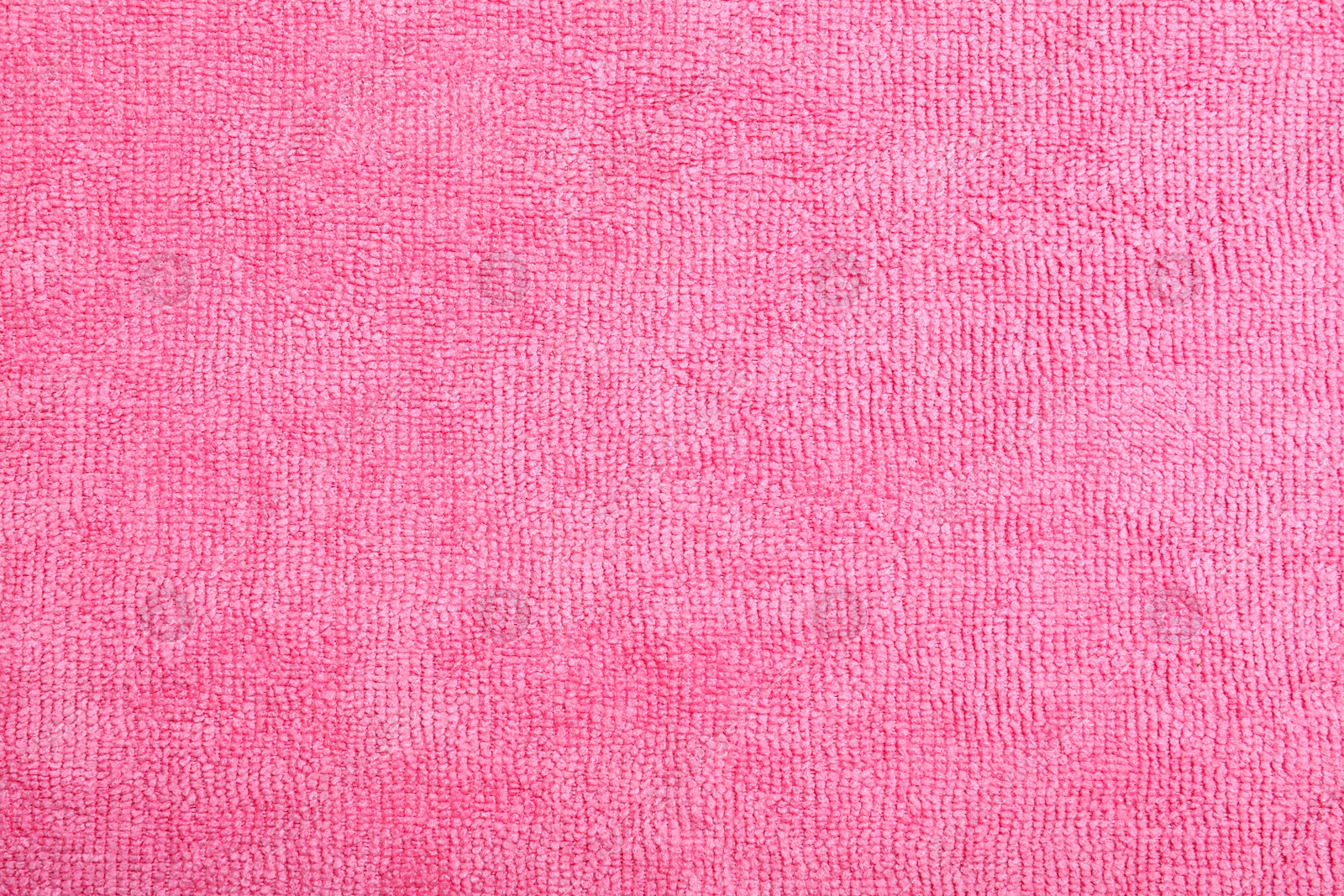 Photo of Pink microfiber cloth as background, top view