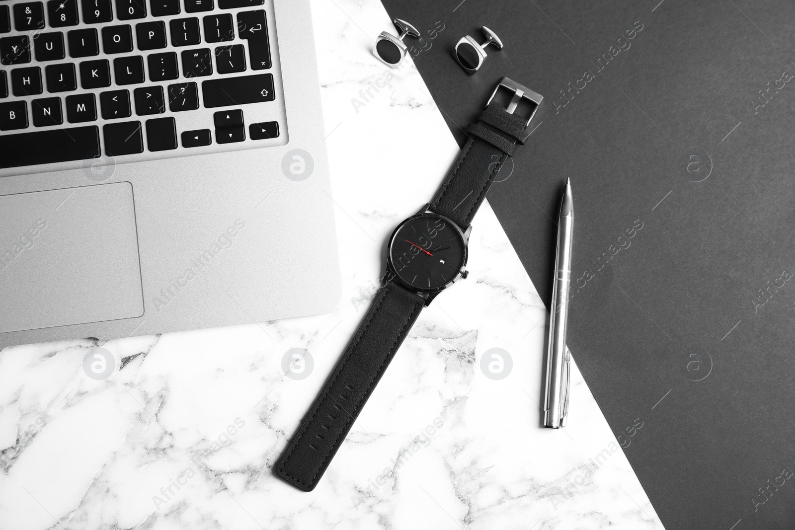 Photo of Flat lay composition with stylish wrist watch and laptop on marble background. Time management