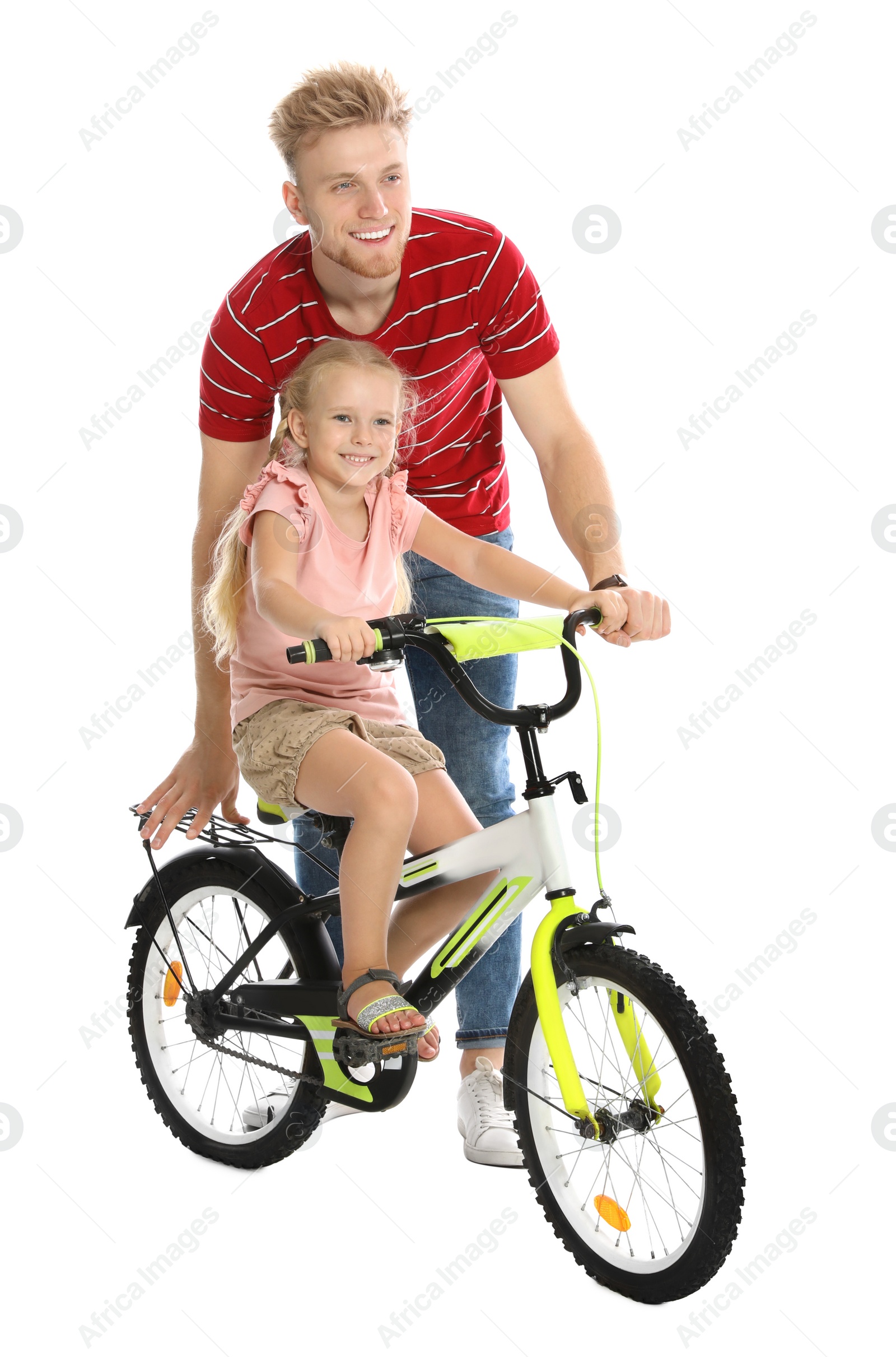 Photo of Young father teaching daughter to ride bicycle on white background