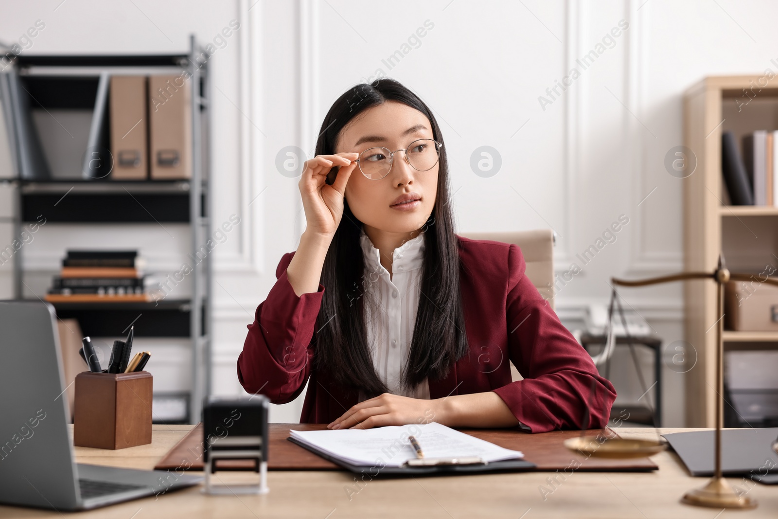 Photo of Portrait of notary at table in office