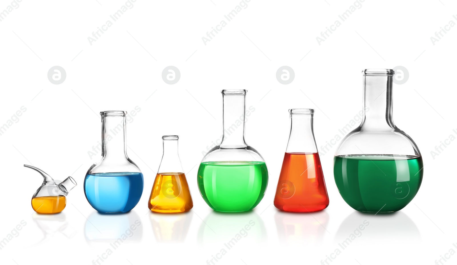 Photo of Laboratory glassware with different samples on white background. Solution chemistry