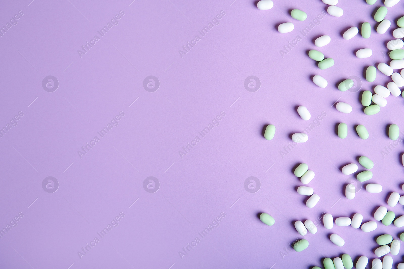 Photo of Flat lay composition with tasty mint candies on color background